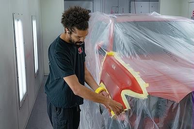 Karl CDJR of Marshalltown factory-trained technician working on a Mopar vehicle